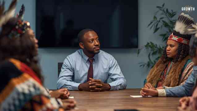 Image of a technology leader having a conversation with his favourite employees but they are all dressed in native american wear.